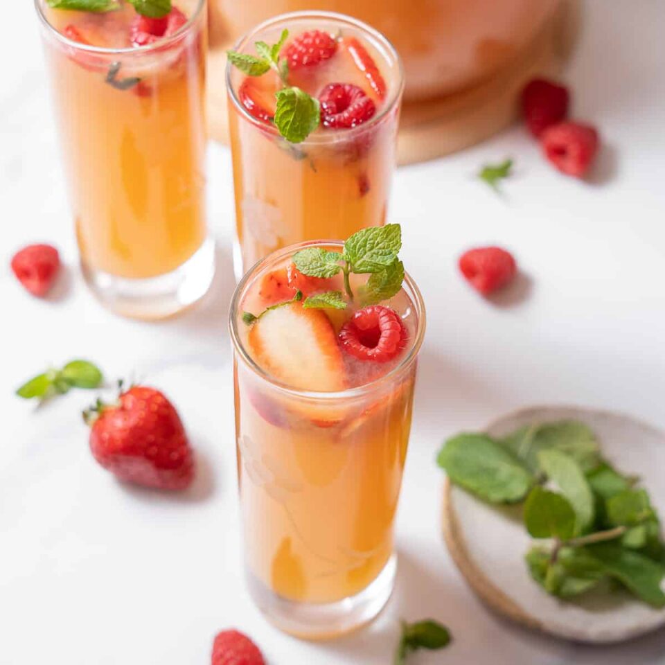 three glasses of rose sangria with mint.