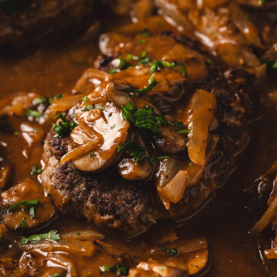 Salisbury steak covered in onions and gravy.