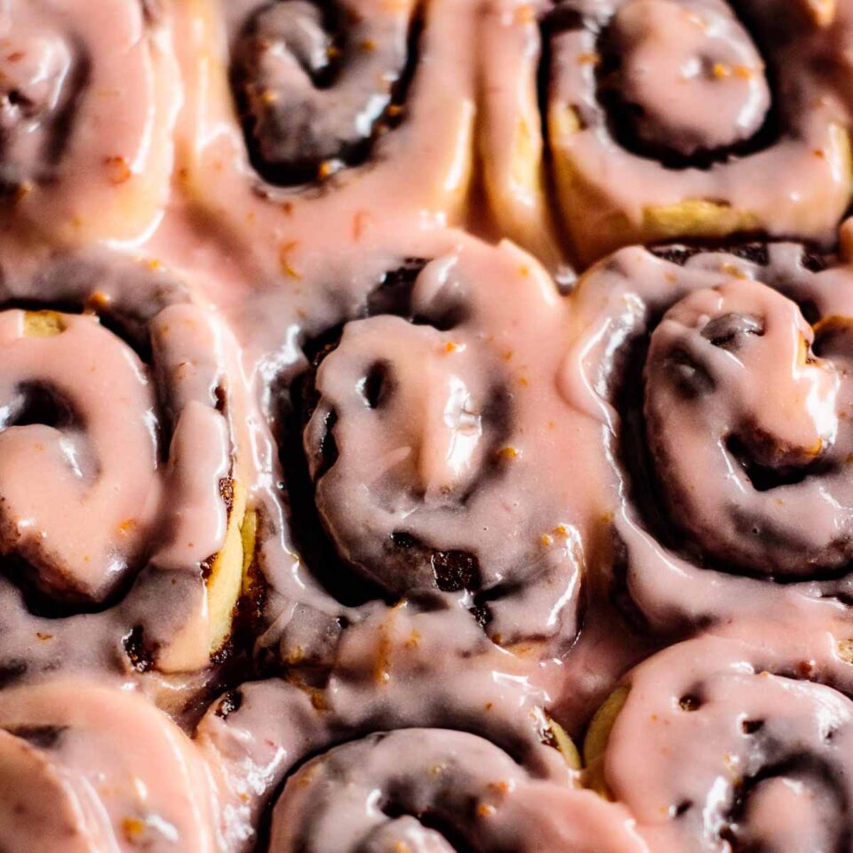 blood orange cinnamon rolls with pink bloos orange glaze