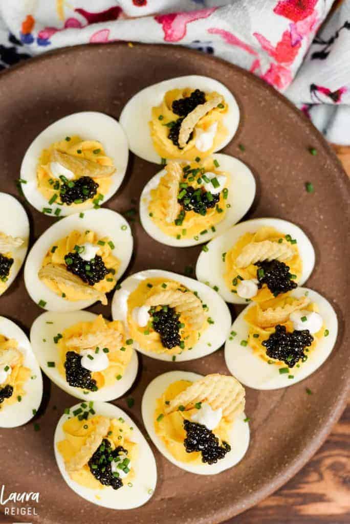 Deviled eggs with caviar and chips.