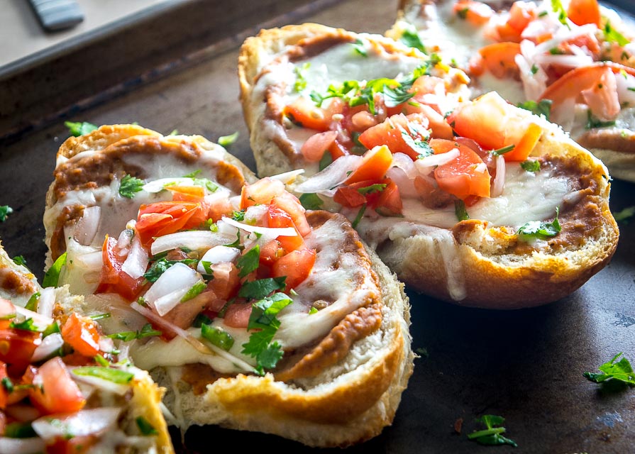 You probably already have all the ingredients you need for these Molletes (Mexican Bean and Cheese Sandwiches). Try them with some freshly made Pico de Gallo -- so good! mexicanplease.com