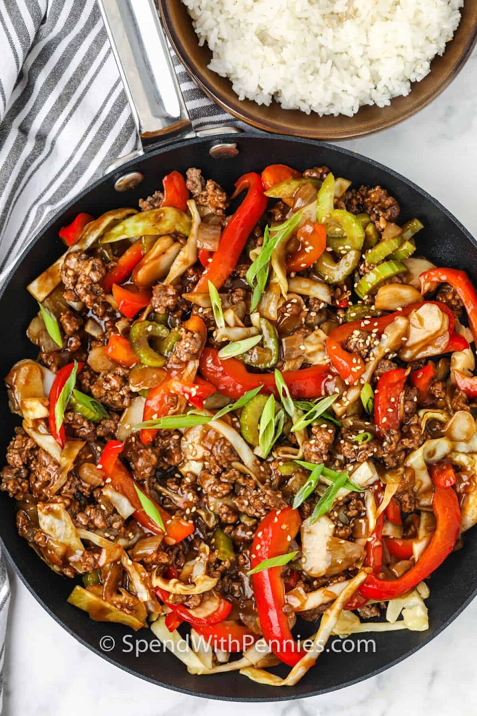 pan of Sesame Ground Beef Stir Fry with a bowl of rice