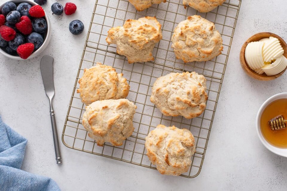 Bisquick biscuits cooling on a wire rack.