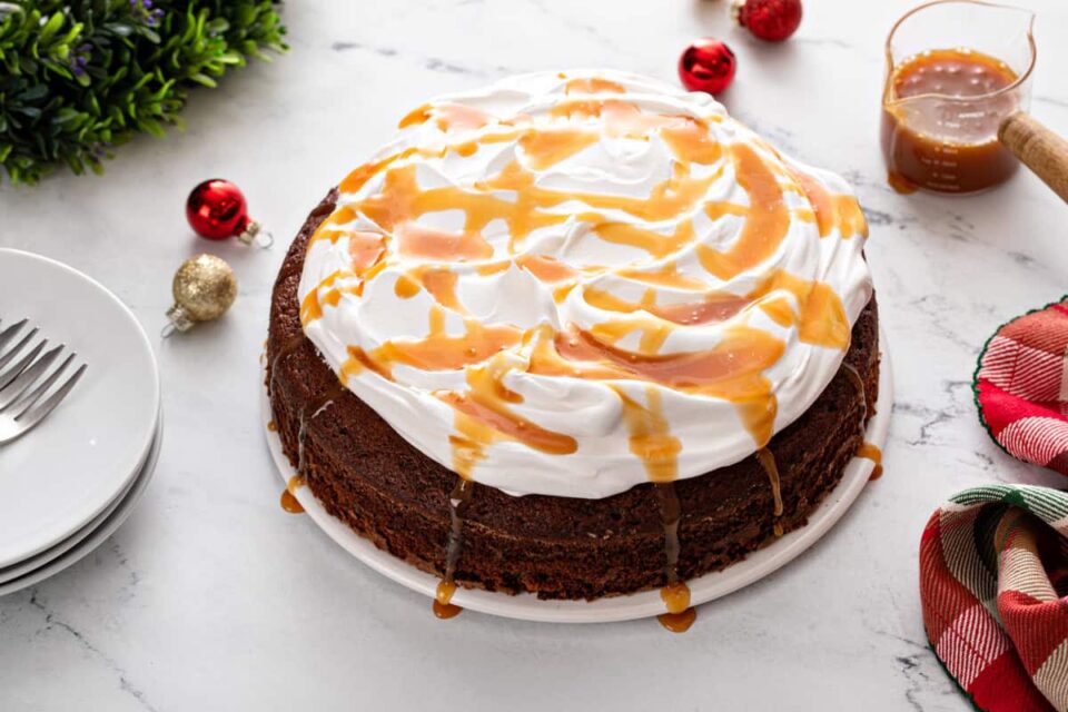 Gingerbread cake topped with whipped cream and salted caramel sauce.