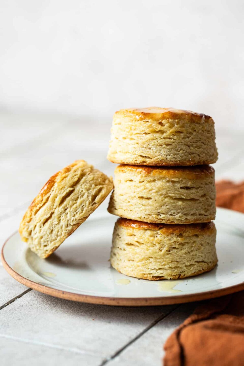 Masa harina biscuits stacked on top of each other on a plate.