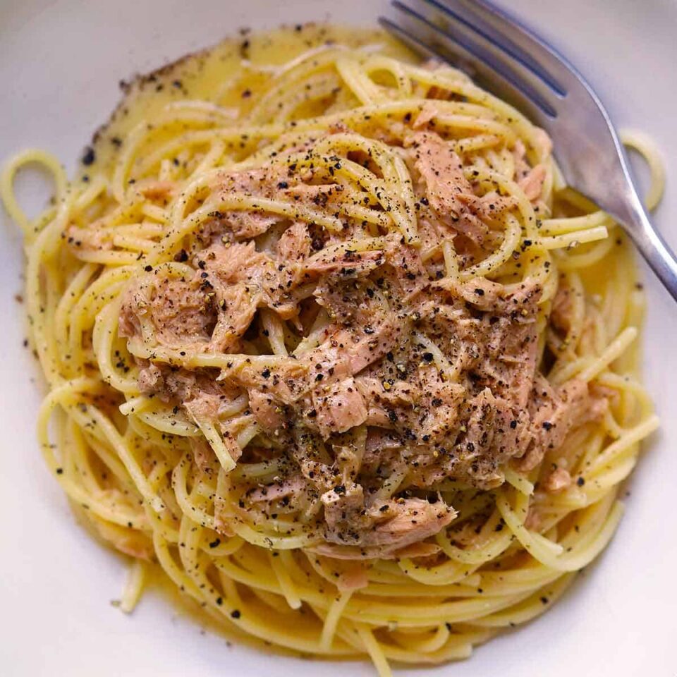 Square overhead photo of spaghetti tonno e burro.