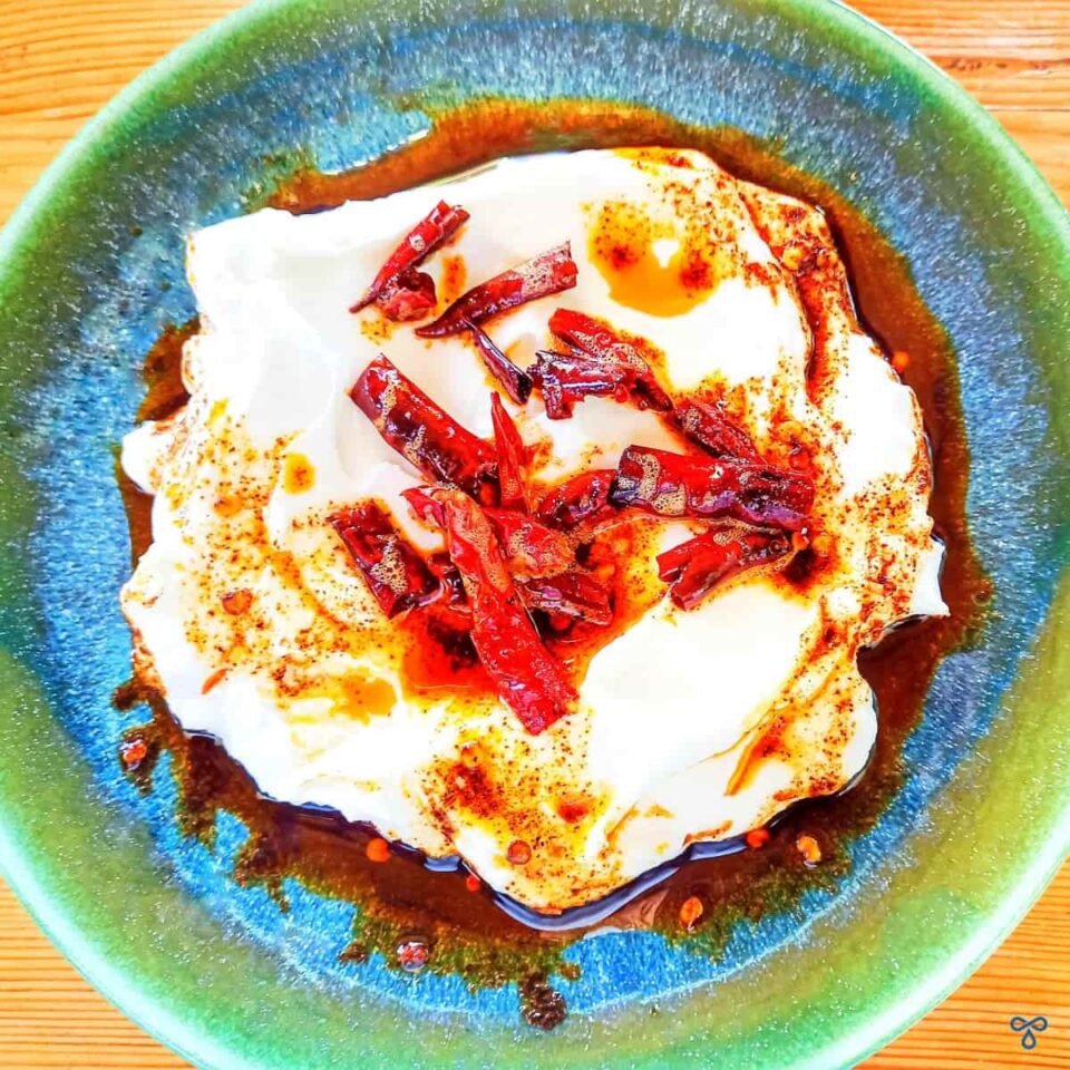 Natural yoghurt topped with dried red chillies and chilli oil.